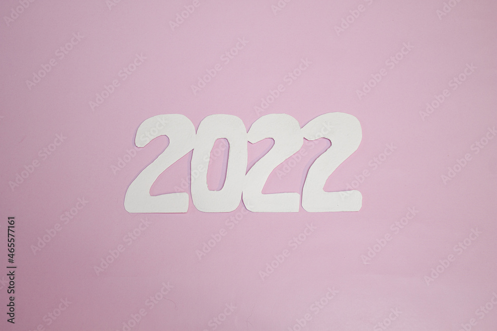 white numbers 2022 on a pink background.