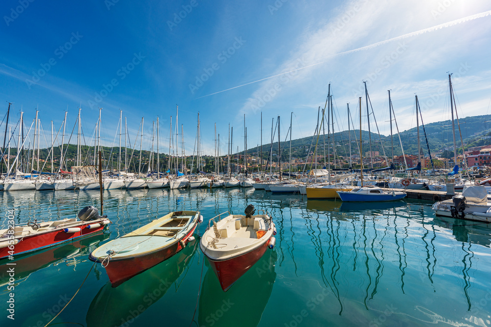 Fototapeta premium Port of the small Lerici town with many sailing boats moored. Tourist resort on the coast of Gulf of La Spezia, Mediterranean sea, Liguria, Italy, Southern Europe.