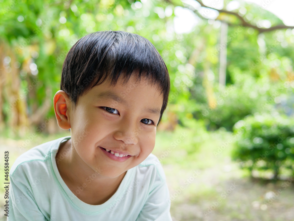 Asian cute child boy smiling with whitening teeth at home. Happy kid in happy moment and enjoying in funny shot in relaxing day. Concept of healthy lifestyle, happy expression. Asian cute child boy smiling with whitening teeth at home. Happy kid in happy moment and enjoying in funny shot in relaxing day. Concept of healthy lifestyle, happy expression.
