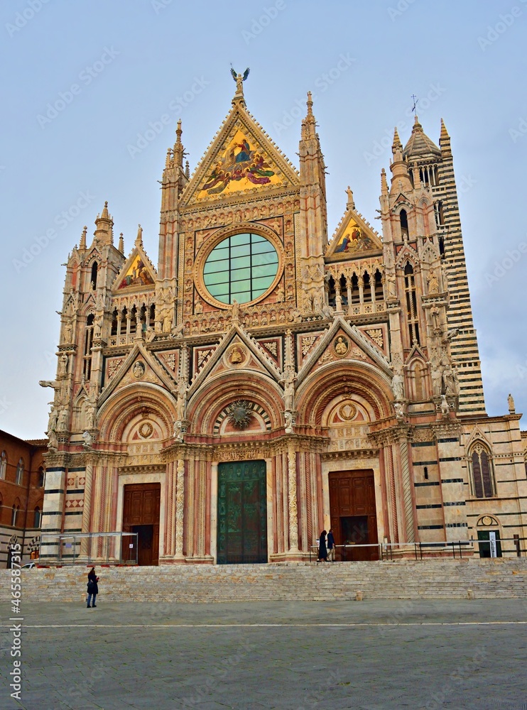 external facade of cathedral of Santa Maria Assunta in the historic center of Siena in Tuscany, Italy