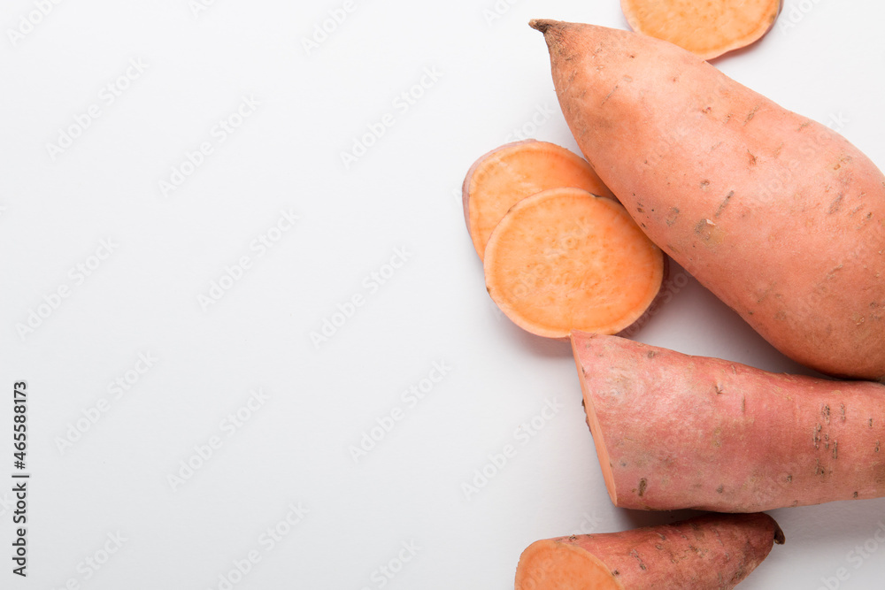 Sweet potato vegetable on a white background. Sliced ​​sweet potato. In the Cut.