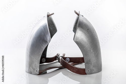Steel metal shoulder pads to protect torso. Iron steel ammunition, personal accessories for a knight: helmet, chain mail, limb protection. concept is a reconstruction of battles. photo