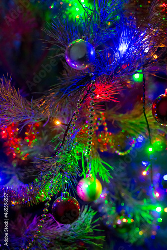 Christmas sparkling toys with illumination. Decorative toys on Christmas tree. concept is Christmas Night.