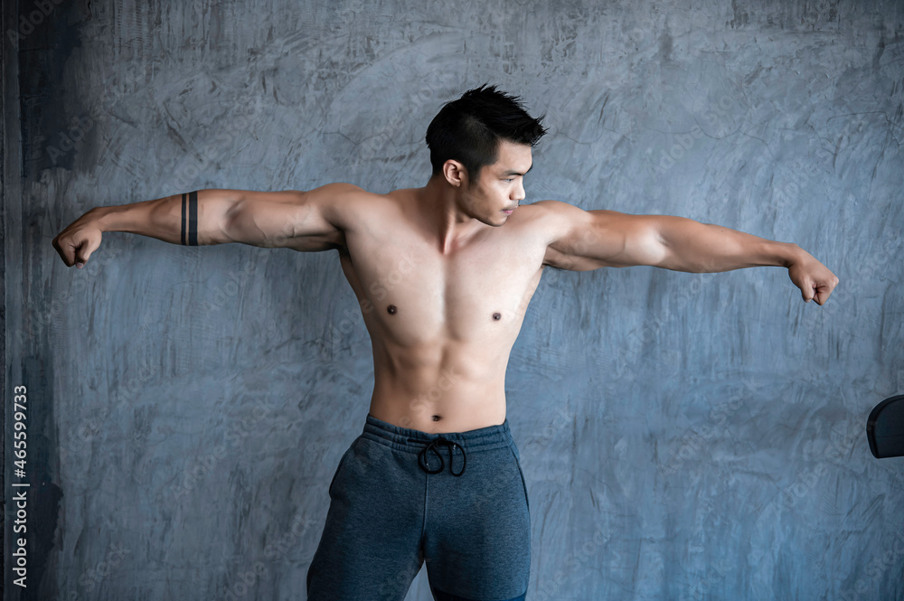 Portrait of asian man big muscle at the gym,Thailand people,Workout for good healthy,Body weight training,Fitness at the gym concept