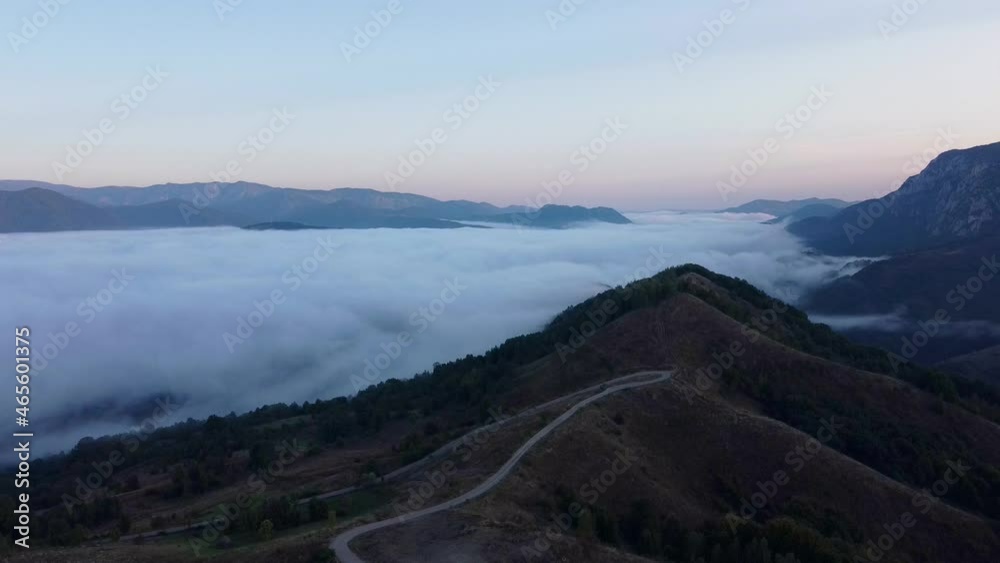 Road in Mountains and Clouds in Background Aerial View Road in Mountains and Clouds in Background Aerial View