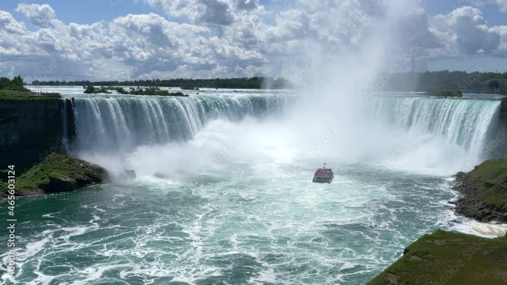 Tourist Boat Maid of the Mist in Niagara Falls Basin, sunny day STATIC Tourist Boat Maid of the Mist in Niagara Falls Basin, sunny day STATIC
