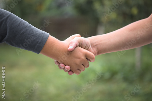 Beautiful Peace Symbol - Child Holding Hands. Handshake boys