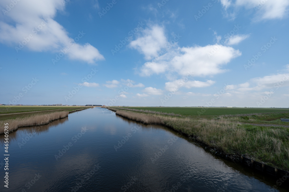 Dutch landscape, polders and water channels in Zeeland, Netherlands Dutch landscape, polders and water channels in Zeeland, Netherlands