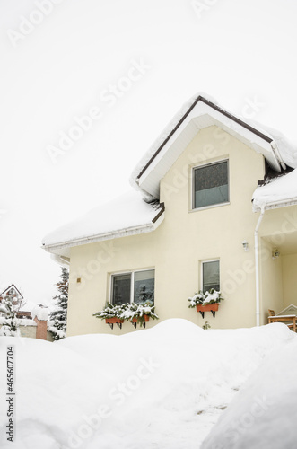entrance of a private house under snow in winter © berna_namoglu