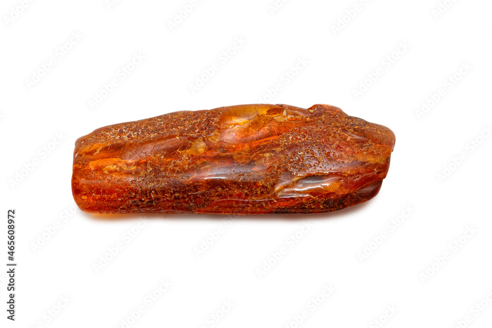 A piece of oblong amber on a white background. Polished semi-precious colored mineral. Material for jewelry. Copal. Ancient fossil resin. Sun stone. Crystal. Geology and minerals A piece of oblong amber on a white background. Polished semi-precious colored mineral. Material for jewelry. Copal. Ancient fossil resin. Sun stone. Crystal. Geology and minerals