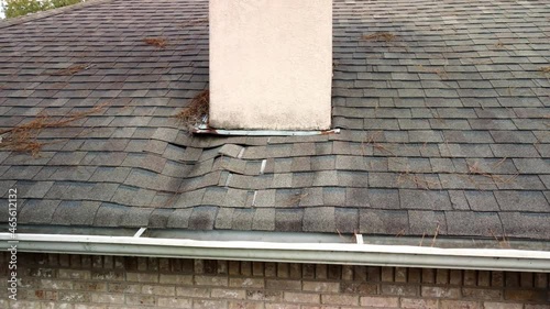 Roof and shingles damaged from water leak and leaves