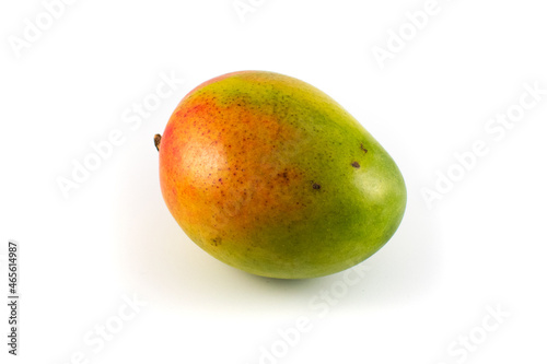 Close up photo of a ripe mango with stem