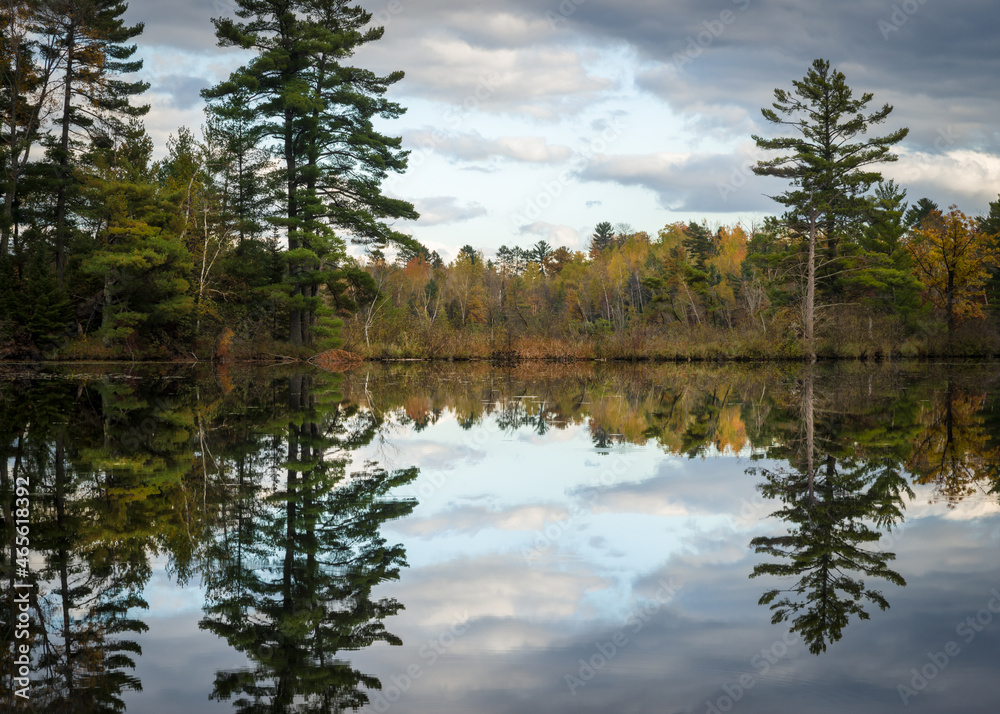 Sunset reflections on a secluded Northwoods lake in autumn. Sunset reflections on a secluded Northwoods lake in autumn.