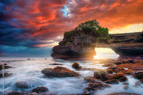 Tanah Lot Temple on sea at sunset in Bali Island, Indonesia.