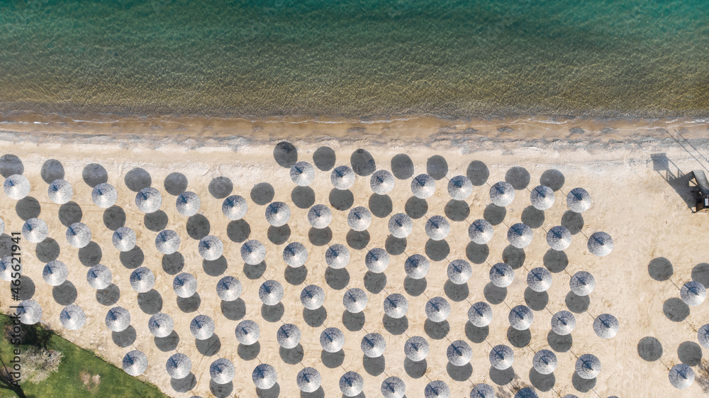 Natural background and abstraction. View from the height on the umbrella of the sea beach.