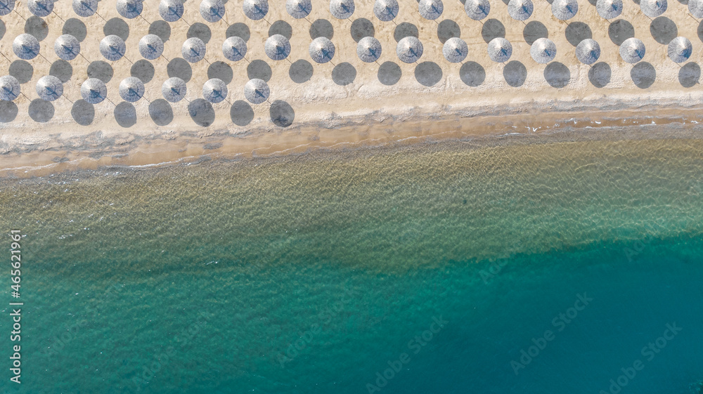 Natural background and abstraction. View from the height on the umbrella of the sea beach.