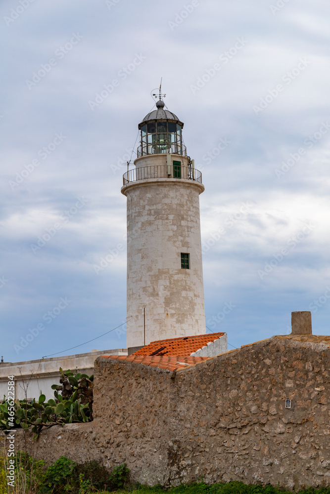 Far de la Mola, a lighthouse on the southeastern tip of the island of Formentera in the Balearic Islands, Spain - White lighthouse on the top of a cliff in the Mediterranean Sea