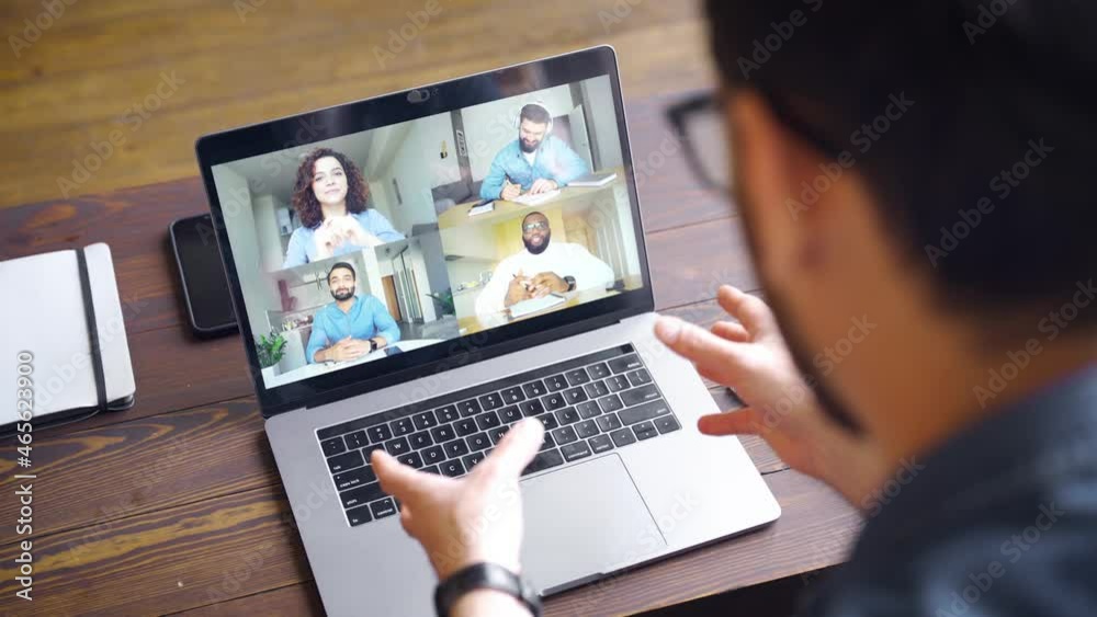 View of business man talking to colleagues about plan during video conference