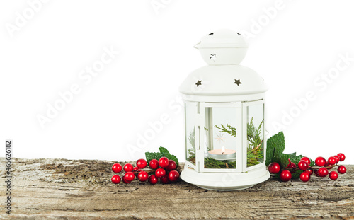 White lantern with candle inside and Christmas decoration. Copy space. photo