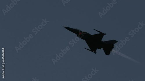 Fighter jet flying at night