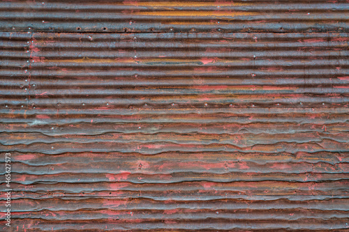 old, grunge, rusty, corrugated metal texture background - wall of weathered shack photo