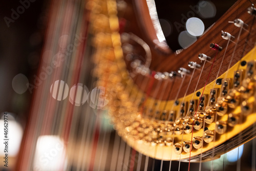 Tableau sur toile A part of a harp in stage light with bokeh