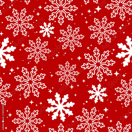 christmas festive pattern of curly snowflakes on a red background
