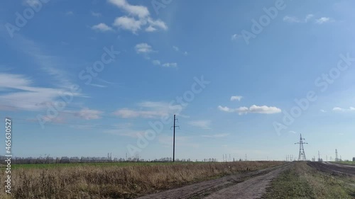 Clouds on the background of a field road