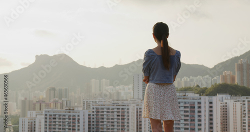 Photography Woman look at the city of Hong Kong in the evening