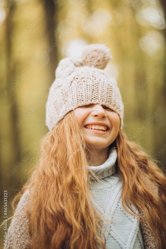 Cute girl with long red hair in autumnal forest Cute girl with long red hair in autumnal forest