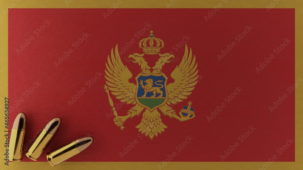 Three 9mm bullets in the bottom left corner on top of the national flag of Montenegro Three 9mm bullets in the bottom left corner on top of the national flag of Montenegro