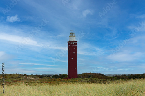 Westhoofd lighthouse in Ouddorp in the Netherlands, in a green landscape photo