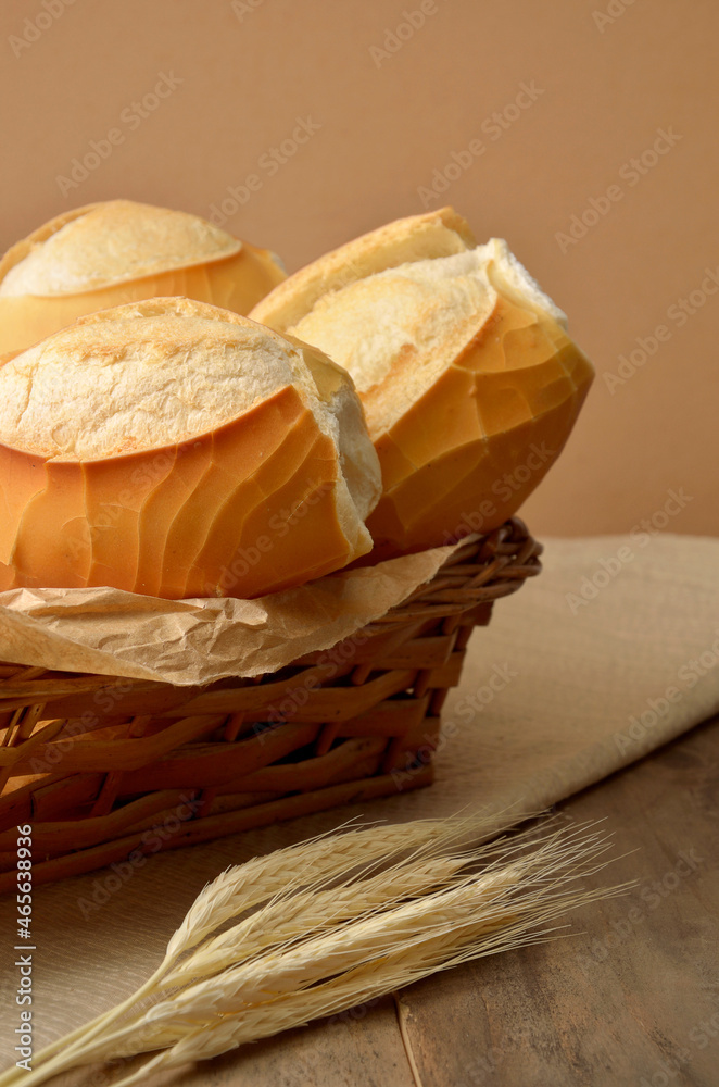 basket with french bread on wooden table