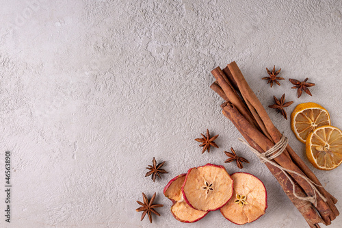 set of spices for mulled wine on a gray plaster background