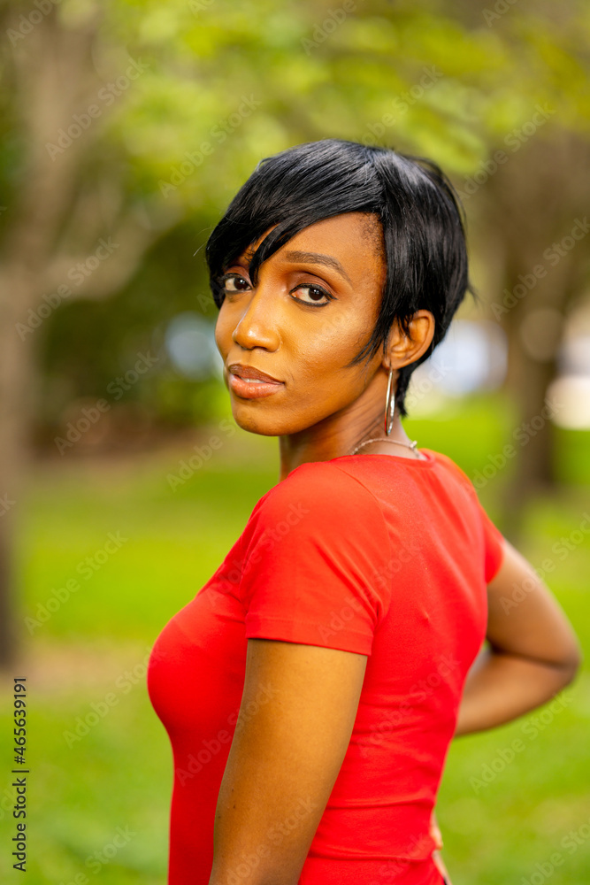 Beautiful young woman model glancing over shoulder at camera Beautiful young woman model glancing over shoulder at camera