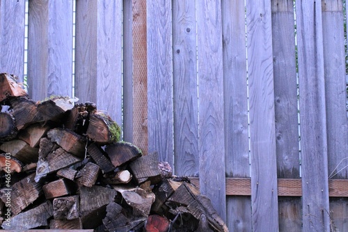 Принти на полотні a wooden fence with chopped wood