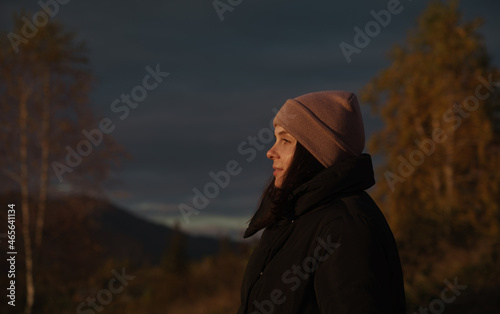 Profile view of a Happy woman watching sunset