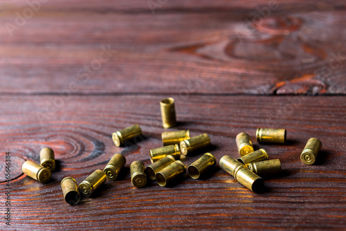 cartridge cases on a wooden table
