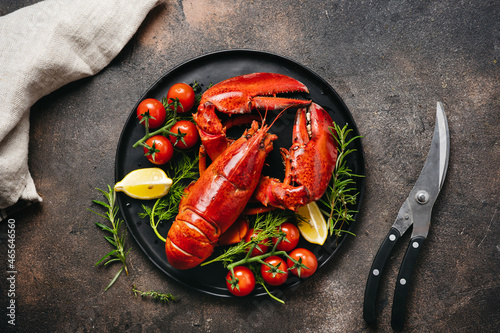 Konstfotografi Delicious freshly cooked lobsters on black plate