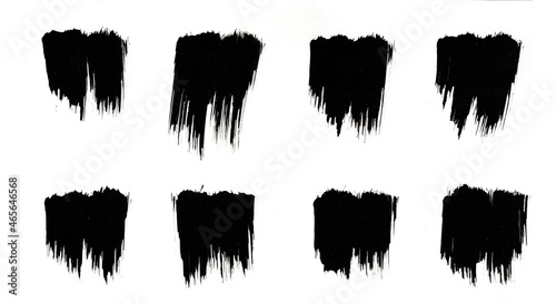 Black paint brush strokes made of watercolor on paper.