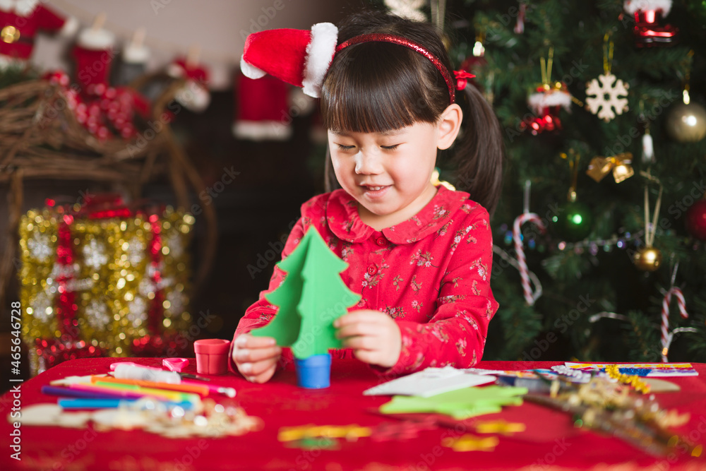 young girl making christmas craft at home young girl making christmas craft at home