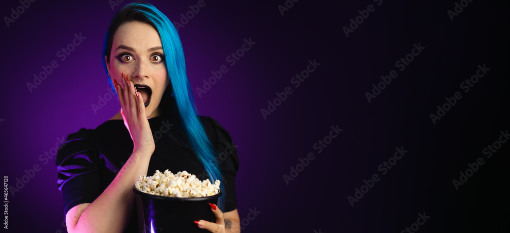 Big banner woman on black friday, shopping, expressions, surprise with popcorn bucket in hand, blue hair, copy space, black background, neon style for websites, billboards and boards Big banner woman on black friday, shopping, expressions, surprise with popcorn bucket in hand, blue hair, copy space, black background, neon style for websites, billboards and boards