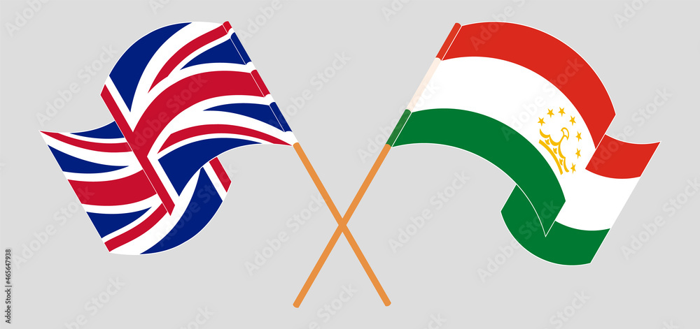 Crossed and waving flags of United Kingdom and Tajikistan Crossed and waving flags of United Kingdom and Tajikistan