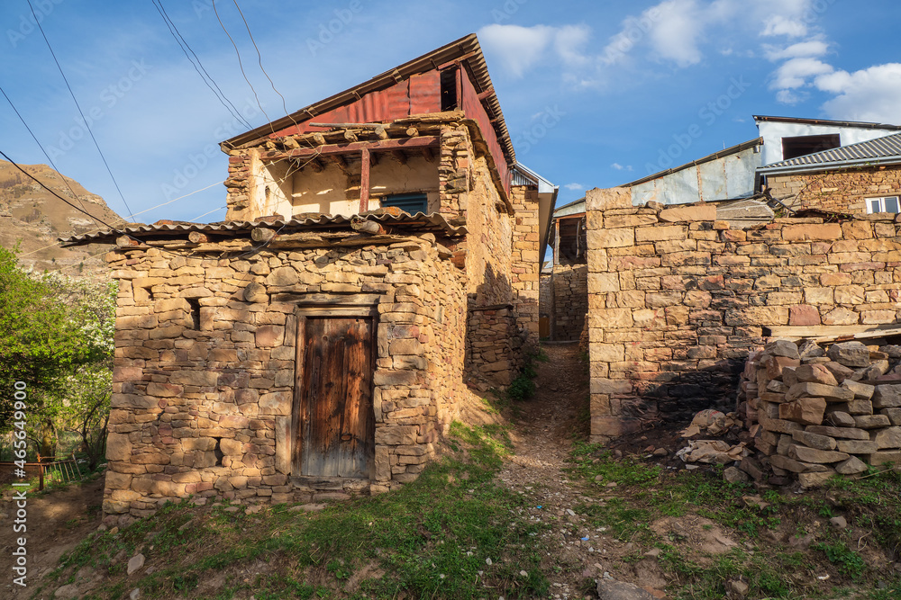 Old mountain village in Dagestan. Narrow alleys of a mountain village. Rural clay and stone houses in a village in Kakhib.