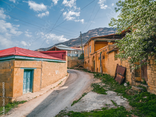Old mountain village in Dagestan. Rural street between stone houses in a village Choh, Dagestan. Russia.