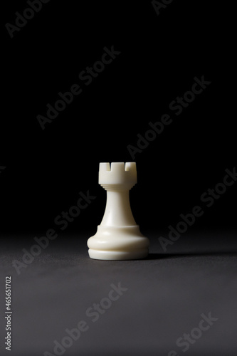 Fotografi isolated white rook chess piece on black background.