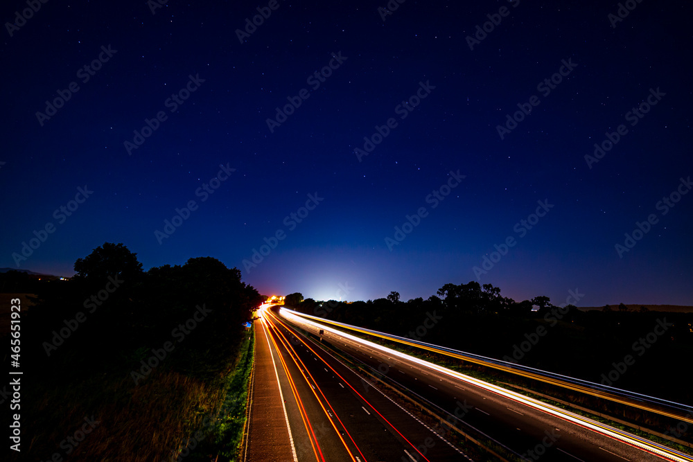 A night time view of the M6 heading towards Penrith the gateway to the English Lake District with the Plough in the night sky