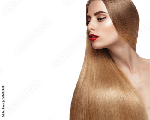 Beautiful blond girl with a perfectly smooth hair, and classic make-up. Beauty face and hair.