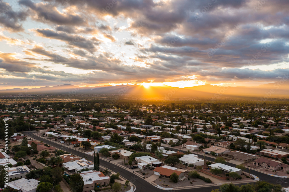 Scenic view of Green Valley Arizona during sunrise with sun rays and clouds
