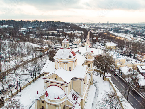 Aerial view of the Church of St. Peter and St. Paul, located in Antakalnis district in Vilnius. Beautiful winter day in the capital of Lithuania. photo